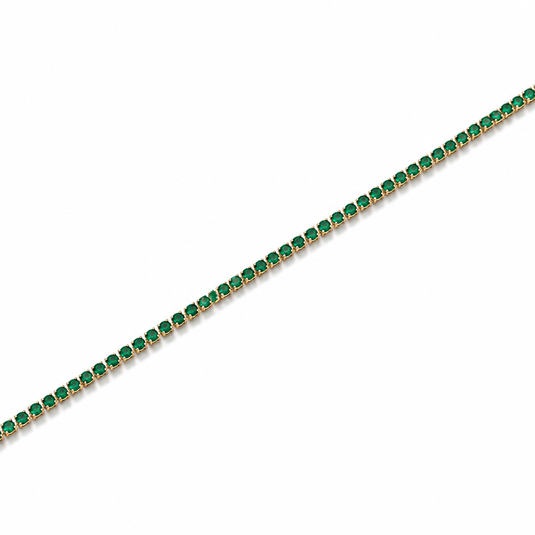 Gold bracelet with green gemstones on a white background
