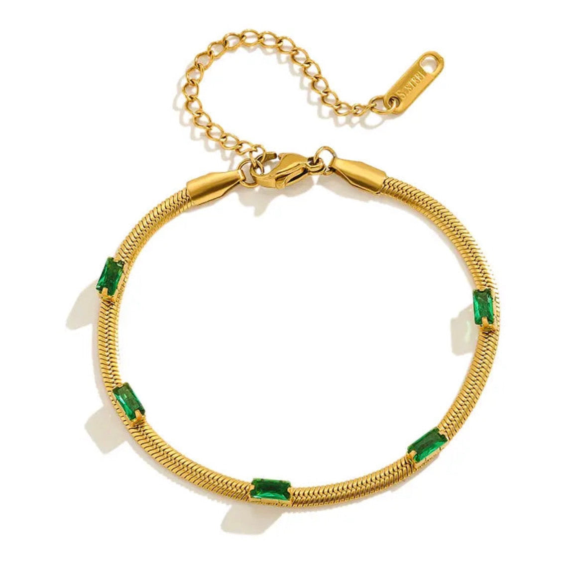 Gold bracelet with green and white stones on a white background